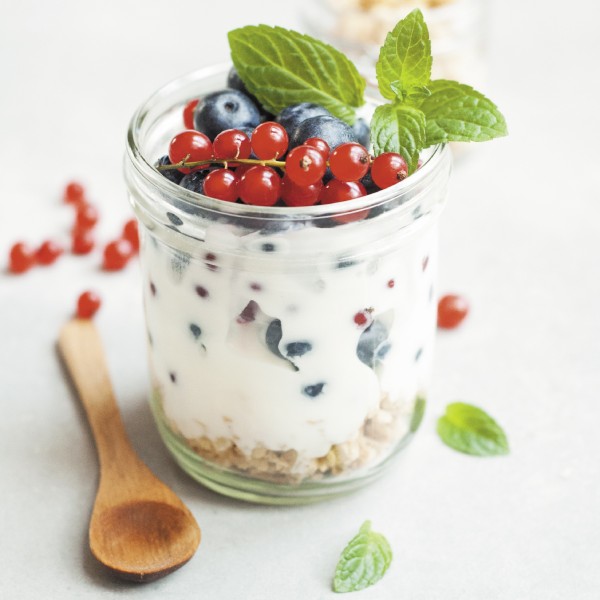 Cup of yogurt with fresh fruit on it